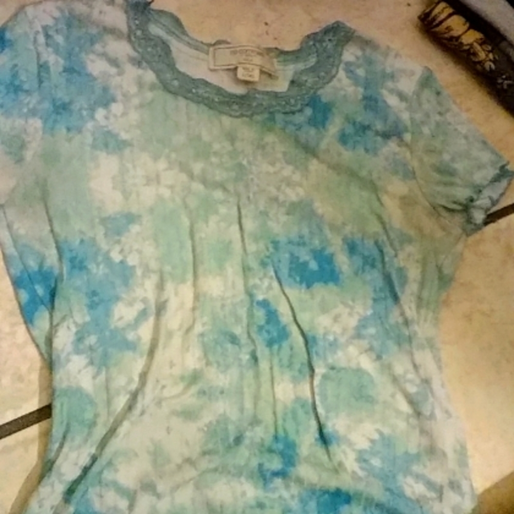 This tie die blue, green, and white shirt from no comment